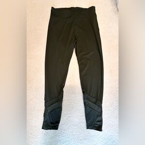 Green legging, with mesh detail on lower calf. Size M. Great condition.